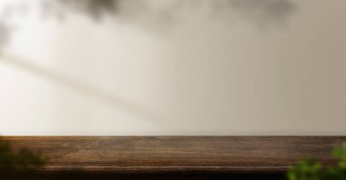 dark brown wood table background with leaf shadow on wall and plant at home