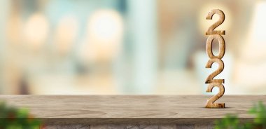 Yeni yıl 2022 (3d yorumlama) bulanık bokeh hafif arka plandaki kahverengi ahşap masa üzerinde, bulanık yaprak önplanı ile, ürün gösterimi için afişi düzenleyin, bayram tebrik kartı