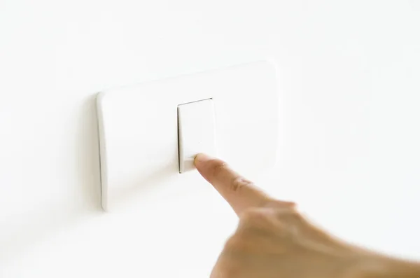 Finger press on light button — Stock Photo, Image