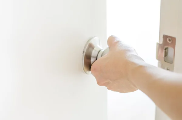 Hand opening door knob,white door — Stock Photo, Image