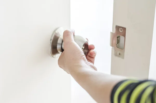 Hand opening door knob,white door — Stock Photo, Image