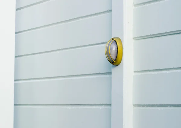 Wall lamp on pole at cement wall — Stock Photo, Image