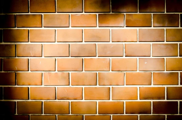 Grunge pared de ladrillo naranja, tono oscuro — Foto de Stock
