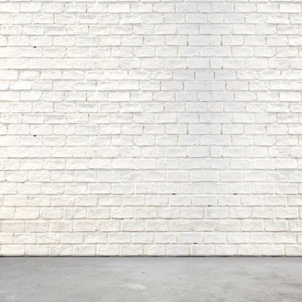 Parede de tijolo branco e piso de cimento — Fotografia de Stock