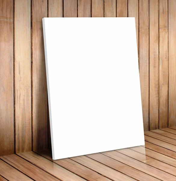 White poster frame in wooden room — Stock Photo, Image