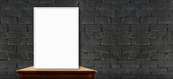 Blank poster on wood table