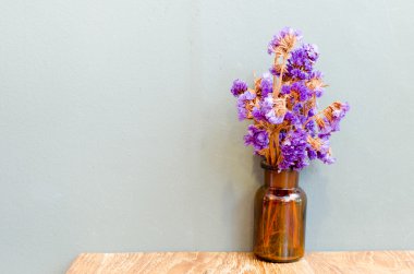 Lavender in bottle on wood table