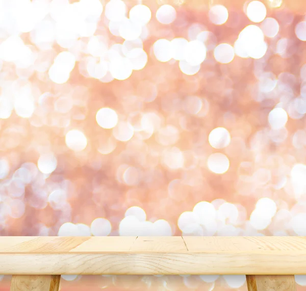 Mesa de madera con rosa bokeh — Foto de Stock