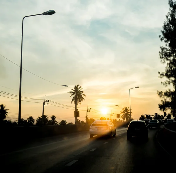 Silhouette landscape of cars on road