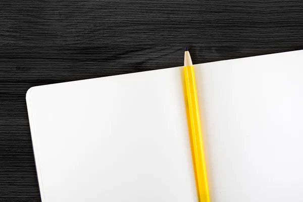 Open notebook and yellow pencil — Stock Photo, Image