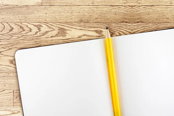 Open notebook and yellow pencil — Stock Photo, Image