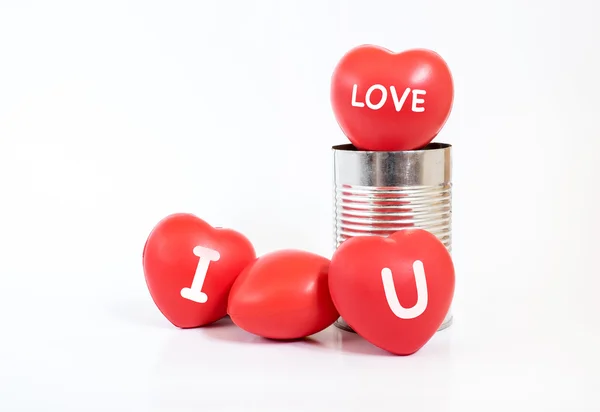 Many Hearts with "I love you and love" word on it in tin can on — стоковое фото