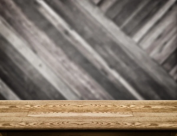 Tapa de mesa de madera vacía con pared de madera diagonal borrosa, Displa producto — Foto de Stock