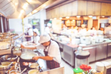 Blurred background : Groups of Chef cooking in the open kitchen,