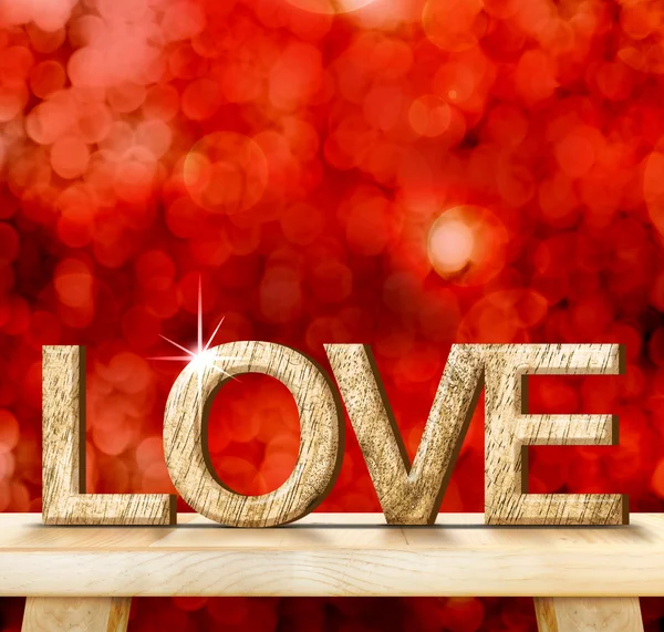 LOVE word in wood texture on wooden table with red bokeh backgro — Stock Photo, Image