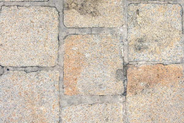 Szorstki bruk kamień grunge tekstury tło — Zdjęcie stockowe