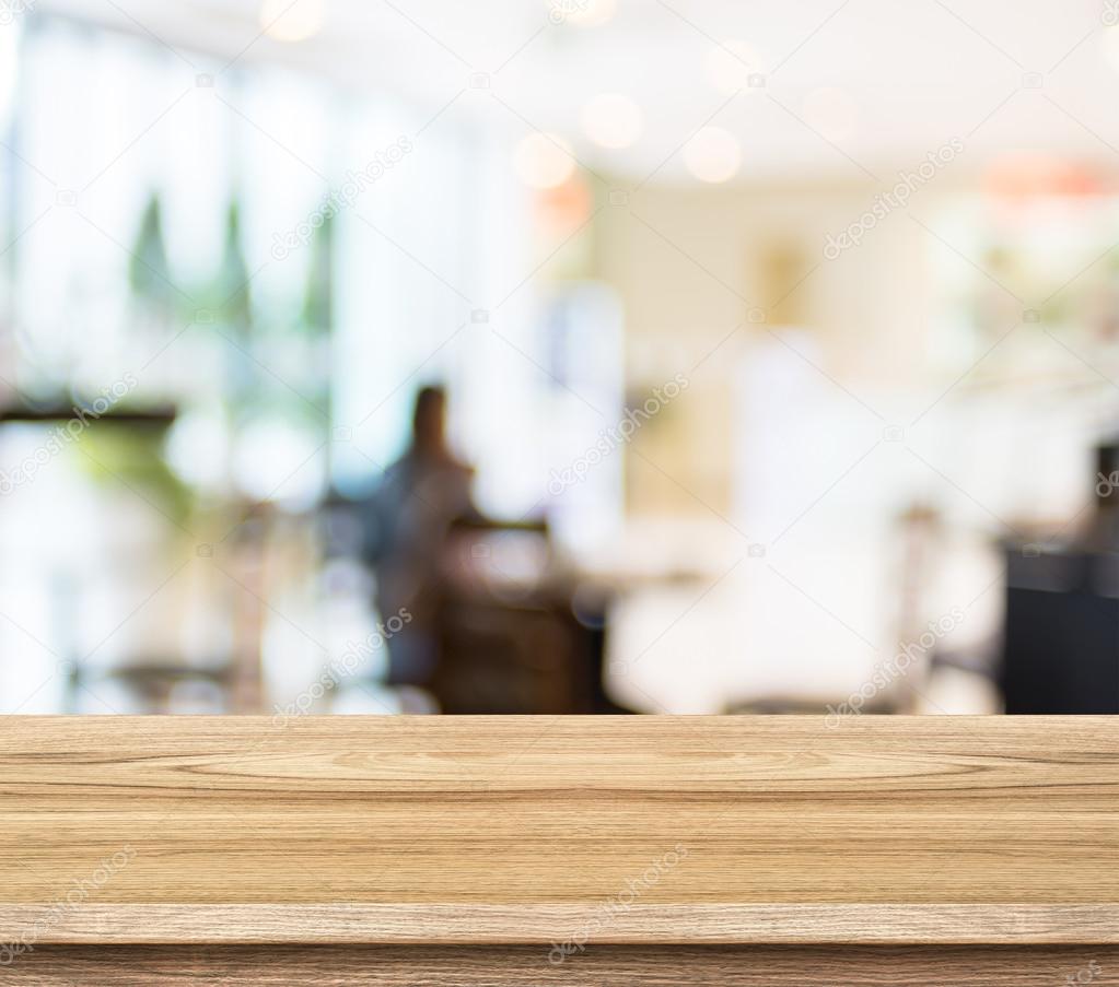 Empty wood table and blurred cafe