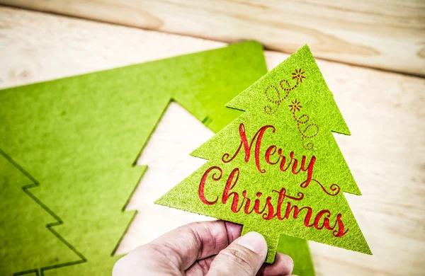 Hand holding Green christmas tree — Stock Photo, Image