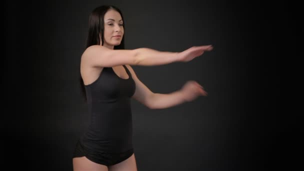 Fitness woman tilts her body — Stock Video