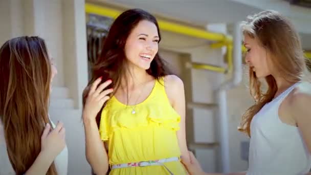 Three young glamorous girl happily boast new dresses on a sunny afternoon — Stock Video