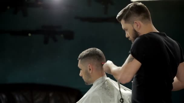 Young man having a haircut with a hair clippers
