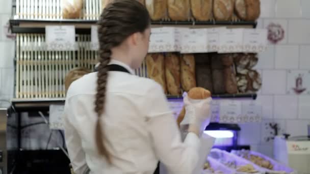 Baker offering a loaf — Stock Video