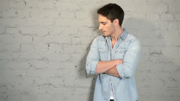 Male posing in a denim and a white T-shirt — Stock Video