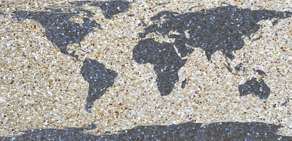Världskartan på sand vägg bakgrund — Stockfoto