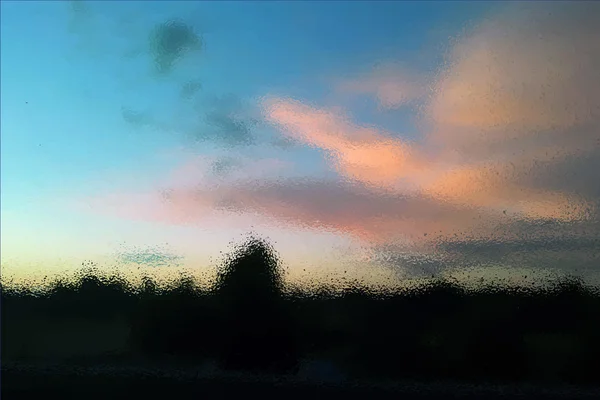 Wolken bei Sonnenuntergang durch das Glas. — Stockvektor