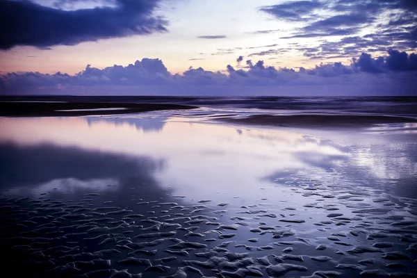 Strandvannsanden – stockfoto