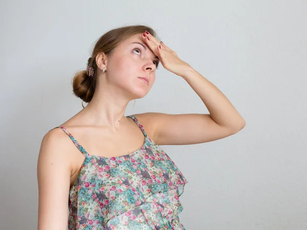 Young woman with hand at forehead feeling tired or some illness — Stock Photo, Image