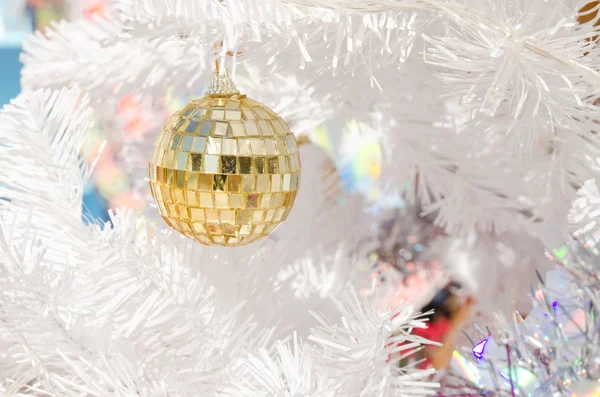 Bell, ball, star on white cristmas tree — стоковое фото