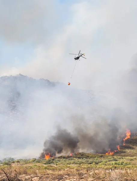 Helicopter drops water over fire in Western Cape