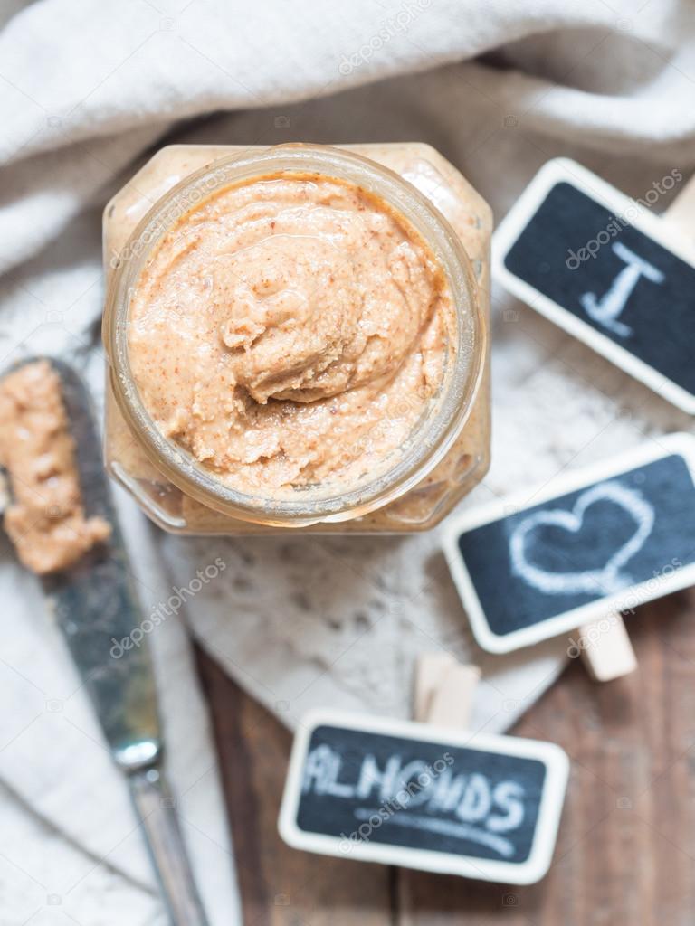 Homemade natural almond butter in a glass jar