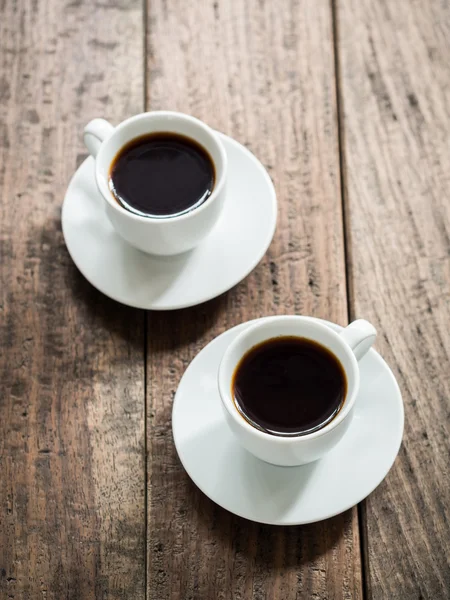 Coffee cups on wooden table — Stock Photo, Image