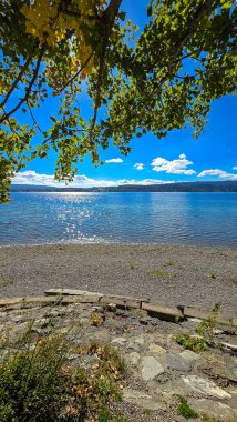 Golden October day at Lake Constance with sparkling water and blue sky