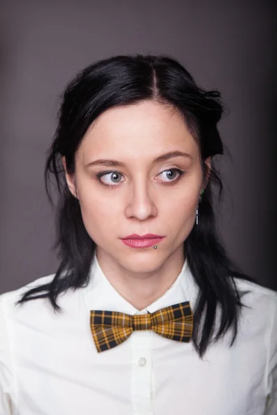 Girl brunette office worker with bow tie — Stock Photo, Image