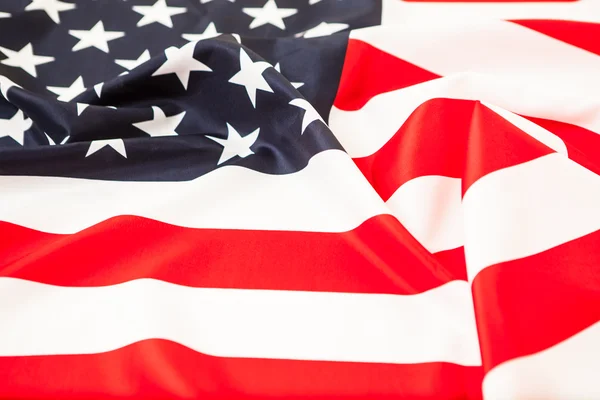 Crumpled flag of the United States lying on the ground. — Stock Photo, Image