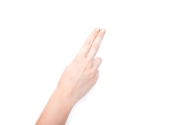 Kvinnlig hand visar gest på en isolerad vit bakgrund — Stockfoto