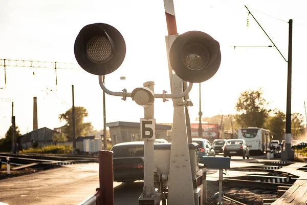 Railway crossing at rush hour — Stock Photo, Image