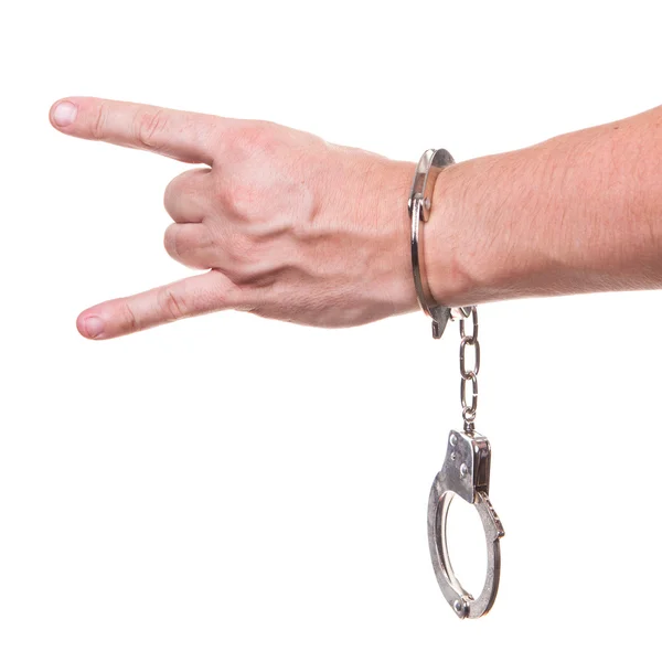 Male hand in police handcuffs showing gesture isolated on white background — Stock Photo, Image