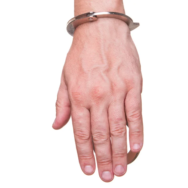 Manlig hand i polis handbojor visar gest isolerad på vit bakgrund — Stockfoto