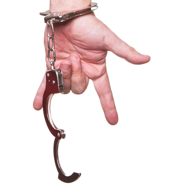 Male hand in police handcuffs showing gesture isolated on white background — Stock Photo, Image