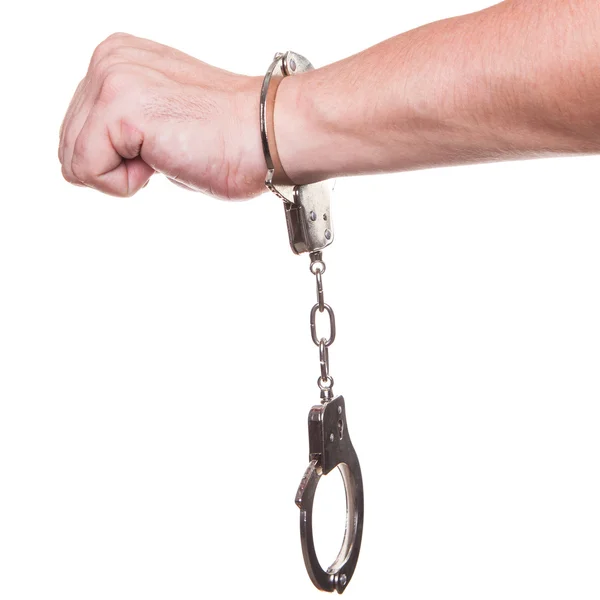 Мужская рука в полицейских наручниках с жестом изолированы на белом фоне — стоковое фото