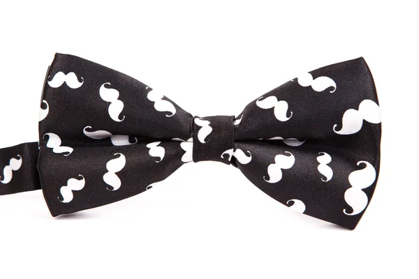 Забавный галстук бабочка черный с белыми усами на изолированном белом фоне — стоковое фото