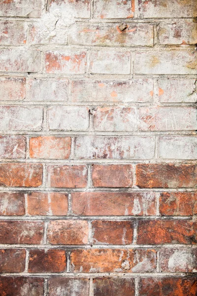 Hintergrund Textur. die Wand des alten roten Ziegels mit weißer Farbe bespritzt — Stockfoto