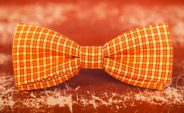 Oranje strikje met witte strepen — Stockfoto