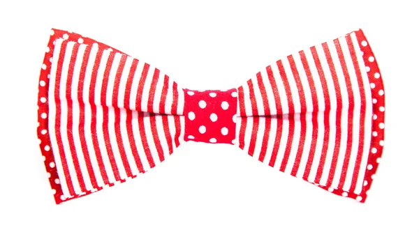 Red bow tie met strepen en noppen op een afgelegen witte achtergrond — Stockfoto