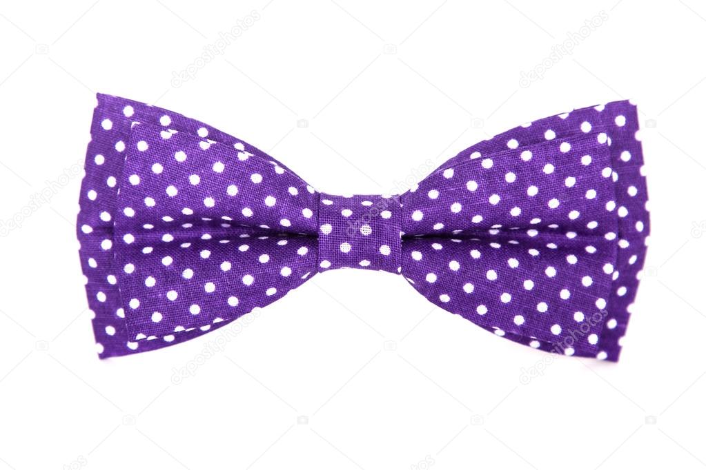 Purple bow tie with white polka dots on an isolated white background