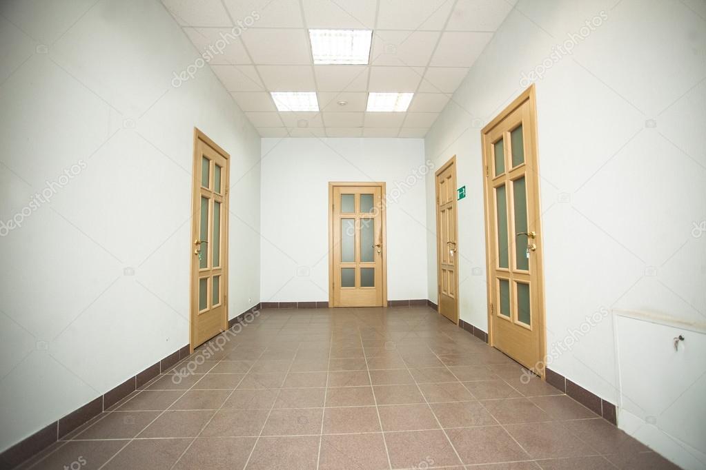 Corridor with five wooden doors